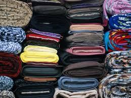 رئيس نقابة عمال الغزل والنسيج يطالب بزيادة الجمارك للأقمشة والملابس