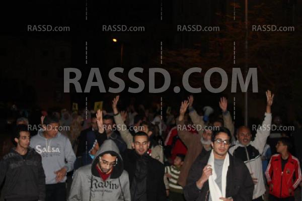 مسيرة ليلية بالشيخ زايد تندد بمحاكمة الرئيس مرسي