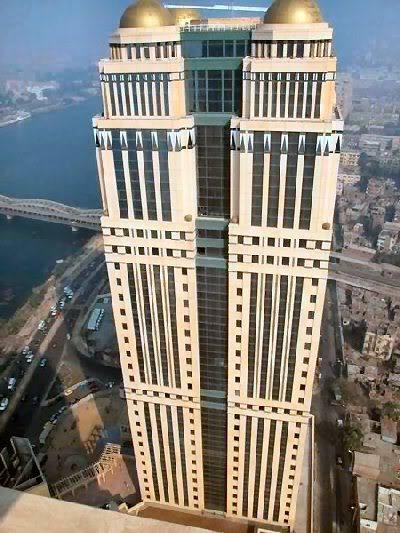 الضرائب تطالب ساويرس وأوراسكوم بالتسوية الضريبية