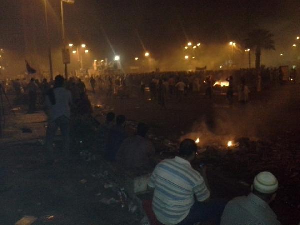 البلطجية يضربون رصاص حي بـ”النهضة” ويحتمون بمدرعات الجيش