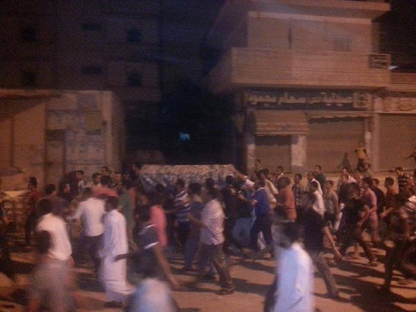 أهالى وادى النطرون يشيعون شهيد مجزرة النصب التذكارى