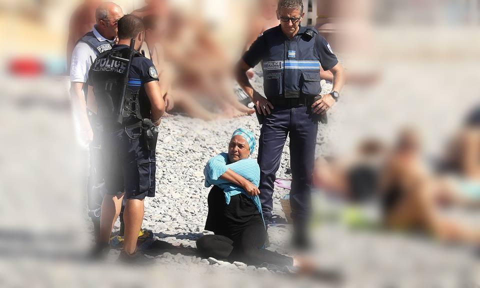 شاهد.. الشرطة الفرنسية تجبر مسلمة على خلع ملابسها على شاطئ نيس