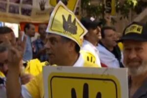 النيابة تأمر بحبس والد تلميذ لحيازته مسطرة عليها شعار رابعة