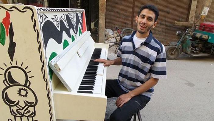 أيهم أحمد.. من مآسي المخيم إلي جائزة بيتهوفن